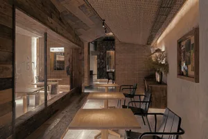 Warm and inviting restaurant interior with wooden tables and chairs, multiple dining tables and chairs, and a focus on comfort