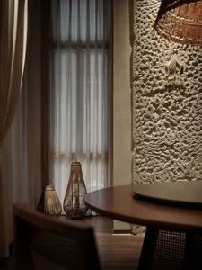 Dining table with two chairs and a bowl, set in a cozy restaurant or home dining area with a warm atmosphere