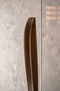 Two wooden artworks hang on a wall in a calm and inviting room with a natural atmosphere