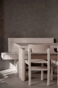 Empty dining area with wooden tables and chairs, creating a calm and inviting atmosphere