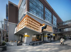 一座現代建築，擁有獨特外觀，混凝土牆上附著眾多小盒子，以極簡風格呈現，強調功能性