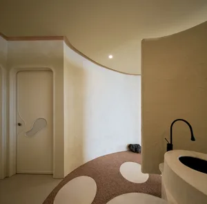 Spacious bathroom with a white color scheme, brown decorative elements, and natural light from the windows
