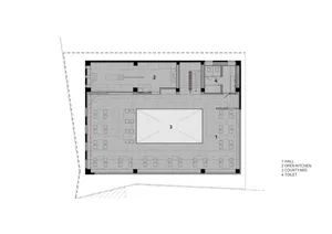 A modern commercial office space with a large open area, multiple rooms, white walls, and a minimalist design