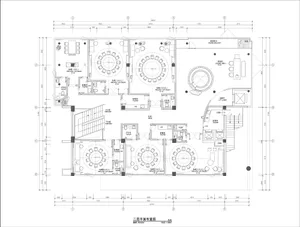 2D floor plan of a modern hotel with various rooms and spaces, including a kitchen, dining area, living room, and bedrooms, with a focus on openness and efficient use of space