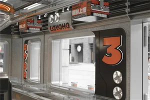 A well-organized counter with three numbered signs in a restaurant or marketplace setting