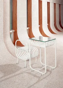 A modern building with a long hallway lined with metal benches and wooden accents, providing a minimalist and modern design