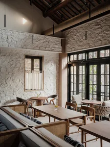 Modern restaurant interior with wooden elements, stone walls, and comfortable seating areas