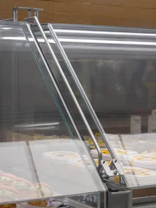 A well-stocked refrigerator with bottles and food items, suggesting a kitchen or dining area with a focus on food storage and organization