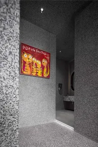 Bathroom with a white sink, mirror, and three tiger posters on the wall, creating a clean and well-organized atmosphere