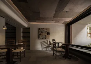 Dimly lit restaurant interior with wooden tables, chairs, and paneling, creating a warm and inviting atmosphere
