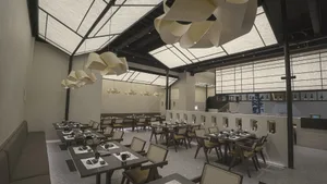 An inviting restaurant interior with multiple dining tables and chairs, creating a comfortable atmosphere for guests