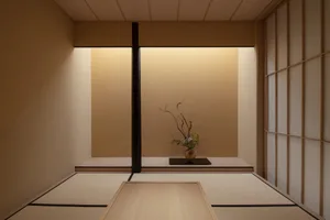 A warm and inviting living space with a wooden table, vases, and a nearby dining table
