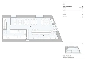 Modern commercial dining space with multiple tables, chairs, and sinks, designed for ample seating and workspace