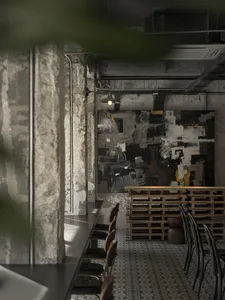 Cozy restaurant interior with wooden tables and chairs, soft ambient lighting, and a warm atmosphere