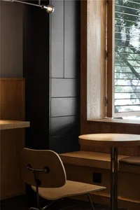 Warm and inviting restaurant interior with wooden tables and chairs, providing seating options for customers