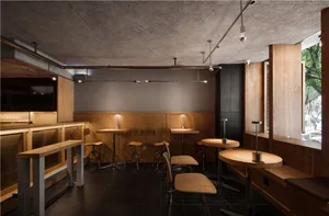 Cozy cafe with wooden tables and chairs, lamps, and a warm atmosphere