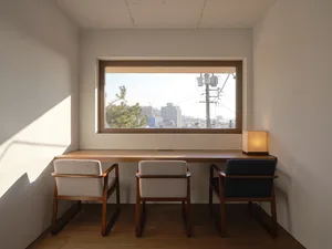 A well-lit dining room with three wooden chairs arranged around a table, perfect for gatherings or meals