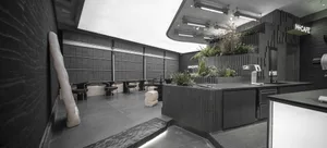 Modern cafe interior with tables, chairs, and potted plants, featuring a comfortable and inviting atmosphere