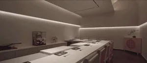Empty restaurant dining area with white walls, tables, and chairs, in need of decoration