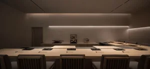 Empty restaurant dining area with wooden tables and chairs, clean and well-organized, ready for customers