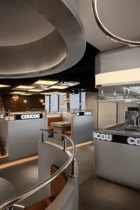 A large dining area with multiple tables and chairs, benches, and an inviting atmosphere