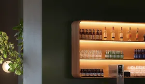 A store display featuring various bottles of beer on wooden shelves, arranged neatly to showcase their variety in an organized and inviting atmosphere