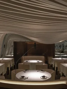 Elegant dining space with modern seating, tables, and contemporary design elements