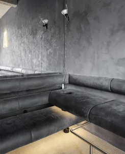 Gray leather couches in a cozy living room with a modern aesthetic
