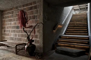 A multi-level staircase with stone steps and a sense of depth and complexity within the structure