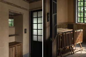 Cozy dining room with wooden chairs, a dining table, and a doorway with a glass window above it