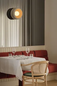 A dining table with multiple wine glasses and cups, set in an elegant and inviting atmosphere