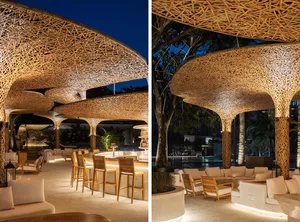 An outdoor dining space with wooden tables and chairs, surrounded by a relaxed and inviting atmosphere, with natural light during the daytime scene