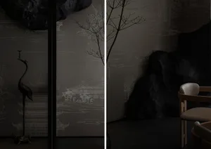 A black and white interior design featuring a rock wall in a minimalist living area with a focus on simplicity