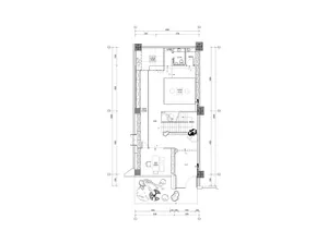 2D floor plan of a small house with a living area, kitchen, and minimalistic design