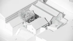 A modern house with a white roof and gray walls, featuring a patio with comfortable outdoor seating and a clean design