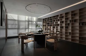 Sophisticated dining area with a round table, wine glasses, and potted plants