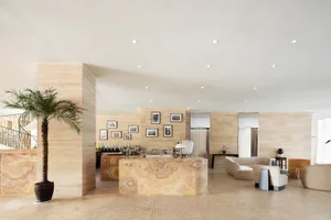 Sleek modern living space with a marble bar, comfortable seating, and a cozy atmosphere