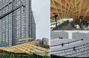 Construction site with modern building under construction, featuring wood as primary material, workers on scaffolding and roof, and a man on a beam