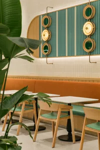 Cozy modern restaurant interior with wooden walls and tables, comfortable seating, and natural ambiance
