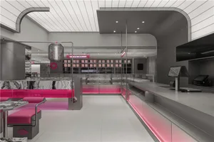 Empty modern restaurant interior with pink walls, chairs, and a welcoming atmosphere