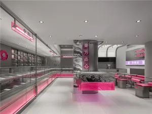 Empty modern restaurant with pink walls and floors, featuring chairs and dining tables in a welcoming atmosphere