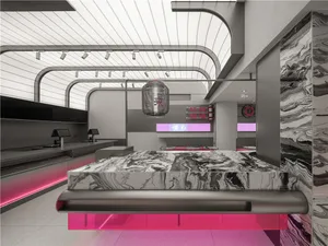 Open concept living space with a large bed, dining table, kitchen counter, metallic headboard, and mounted TV