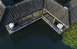 Two Asian-style houses with a wooden exterior, surrounded by greenery, and a water feature with a bridge between them