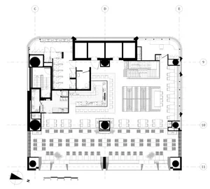 2D floor plan of a modern restaurant with multiple tables, benches, and chairs arranged in a functional layout