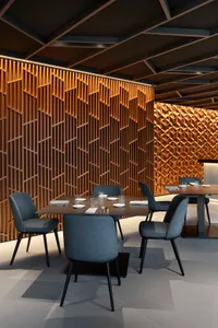 Warm and inviting restaurant interior with wooden walls, tables, and chairs, adorned with white tablecloths