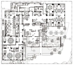 A modern floor plan with open areas and smaller rooms, featuring concrete and wood materials, with natural light from windows and doors