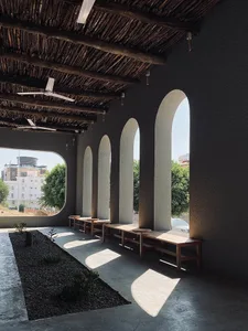 A semi-circular seating area with four benches, creating a comfortable space for socializing and relaxation