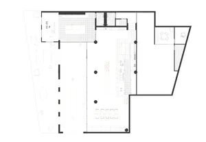 A large empty interior space with white walls, multiple rooms, and no furniture or decorations