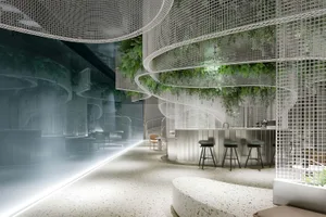 Modern bar area with a circular counter, stools, and chairs, featuring white and grey walls and various lighting sources