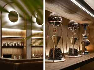 A cozy coffee shop with industrial accents, featuring a mix of clocks, plants, vases, and bottles, creating a warm and inviting atmosphere